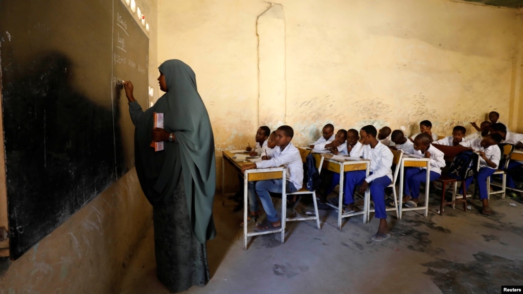 FILE - A teacher conducts a lesson at Banadir zone school in Mogadishu, Somalia, Sept. 22, 2019. 