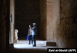 Tourists visit the ancient city of Hatra in northern Iraq, Sept. 10, 2022.