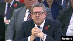 FILE - The head of M15 Andrew Parker is seen attending an Intelligence and Security Committee hearing at Parliament, in this still image taken from video in London, Nov. 7, 2013. (Reuters/UK Parliament via Reuters TV/Files) 