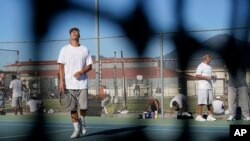 San Quentin State Prison inmate Braydon Tennison reacts after giving up a point during a tennis match against visiting players in San Quentin, Calif., Aug. 13, 2022.
