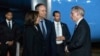 Vice President Kamala Harris, left, and her husband Doug Emhoff, center, are greeted by Robert Godec, U.S. Ambassador to Thailand, upon arrival at Don Mueang International Airport in Bangkok, Thailand, on Nov. 17, 2022, to attend the Asia-Pacific Economic Cooperation summit.