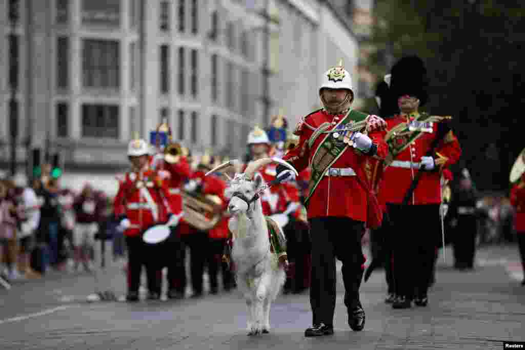 Battalion of the Royal Welsh, supported by the Band of the Royal Welsh, march with their mascot ahead of the proclamation ceremony for Britain's King Charles, following the death of Britain's Queen Elizabeth, at Cardiff Castle in Cardiff, Wales, Britain, 
