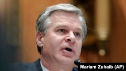 FILE - FBI Director Christopher Wray testifies before a Senate committee in Washington, Nov. 17, 2022. On April 18, 2024, in Nashville, Tennesee, he said that Chinese government efforts to penetrate U.S. infrastructure for the purpose of setting up a cyberattack go back years.