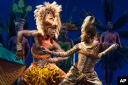 This image released by Disney Theatricals shows Brandon A. McCall as Simba, left, and Pearl Khwezi as Nala during a performance of The Lion King on Broadway in New York on Sept. 14, 2022. (Matthew Murphy/Disney Theatricals via AP)