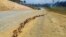 A large crack is seen in a highway near the town of Kainantu, following a 7.6 magnitude earthquake in northeastern Papua New Guinea, Sept. 11, 2022. 