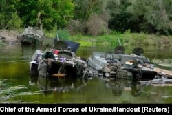 Armored fighting vehicles abandoned by Russian soldiers are seen during a counteroffensive operation of the Ukrainian Armed Forces, in Kharkiv region, Ukraine, in this handout released on Sept. 11, 2022.