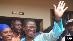 FILE: Freetown City Council Mayor Yvonne Aki-Sawyerr Mayor (2nd L) waves on October 21, 2022 in Freetown, outside the magistrate court where she was accused by police of disorderly behaviour and obstruction of officers trying to arrest elected opposition councillor Sheku Turay,