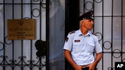 A policeman stands guard outside the Iranian embassy in Tirana, Albania, Sept. 7, 2022. 