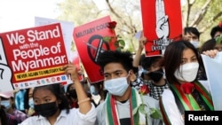 FILE - Myanmar citizens living in India attend a protest against the military coup in Myanmar and demanding recognition of the National Unity Government of Myanmar, in New Delhi, Feb. 22, 2022. 