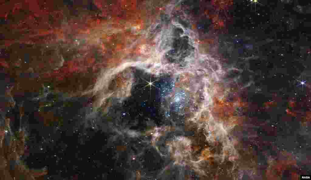 The Tarantula Nebula, the largest and brightest star-forming region near our own galaxy, plus home to the hottest, most massive stars known, is seen through NASA's James Webb Space Telescope, in this image uploaded by NASA on Sept. 6, 2022.