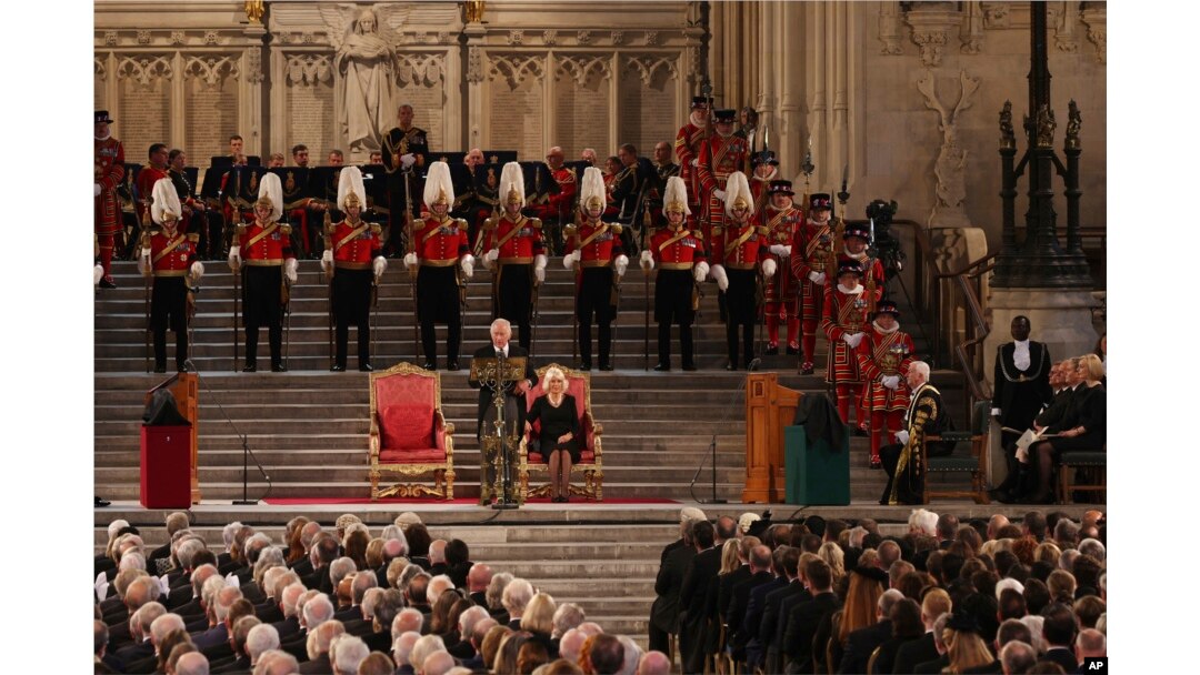 King Charles III gives his address as Camilla, the Queen Consort listens, in Westminster Hall, where both Houses of Parliament met to express their condolences, following the death of Queen Elizabeth II, in London, Sept. 12, 2022.
