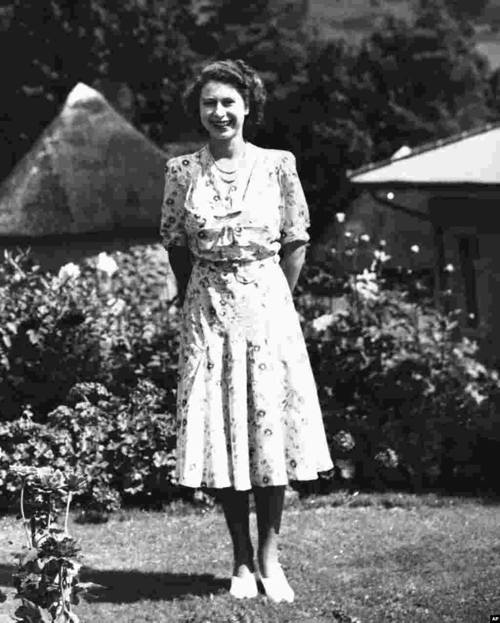 Queen Elizabeth II, then Princess Elizabeth, poses for her 21st birthday release picture, during a three day rest in the Natal National Park in South Africa on April 11, 1947. (AP Photo)