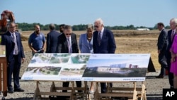 President Joe Biden and Rep. Joyce Beatty, D-Ohio, center, listen as Intel CEO Pat Gelsinger speaks at the groundbreaking of the new Intel semiconductor manufacturing facility in New Albany, Ohio, Sep. 9, 2022.