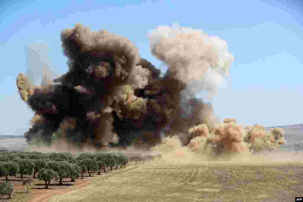 Dust and smoke rise during a reported Russian forces bombing, in the Syrian rebel-held western countryside of Idlib, Syria.