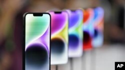 FILE: New iPhone 14 models are seen during Apple's launch event at the company's headquarters in Cupertino, Calif., Wednesday, Sept. 7, 2022