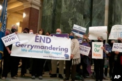 Protesters rally against new congressional maps at the Wisconsin state Capitol in Madison, Wisconsin, Oct. 28, 2021.