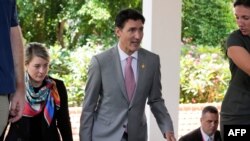 Canada's Prime Minister Justin Trudeau walks after an emergency meeting to discuss a missile strike on Polish territory on the sidelines of the G20 Summit in Bali, Nov. 16, 2022. 