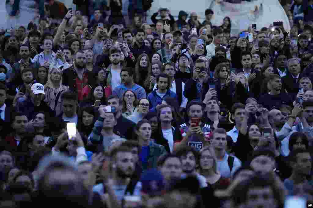 People gather outside Buckingham Palace in London, Sept. 8, 2022, after the death of Britain's Queen Elizabeth II was announced.