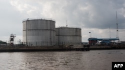 FILE - An oil storage facility is pictured in Warri, Delta State, Nigeria, June 8, 2016. Nigeria has lost its position as Africa's top oil producer to Angola, industry insiders say.