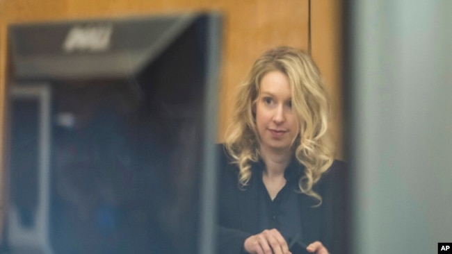 Theranos founder and CEO Elizabeth Holmes arrives at federal court in San Jose, Calif., Nov. 18, 2022. A federal judge sentenced her to prison for duping investors and endangering patients while peddling a bogus blood-testing technology.
