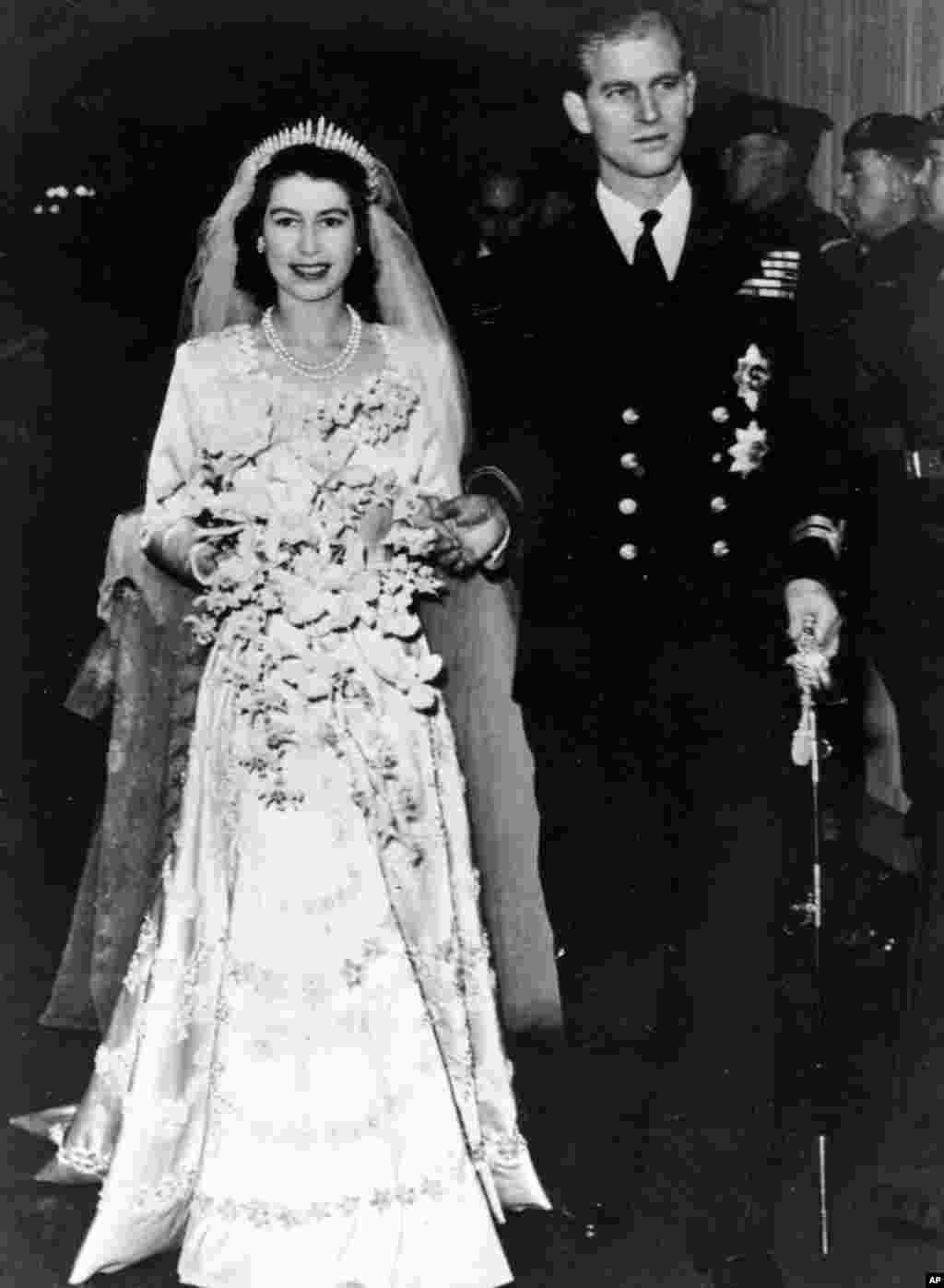 Princess Elizabeth leaves Westminster Abbey in London, with her husband, the Duke of Edinburgh, after their wedding ceremony, Nov. 20, 1947.