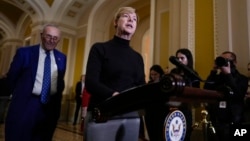 Democratic Senator Tammy Baldwin, at podium, joins Senate Democratic Majority Leader Chuck Schumer to talk about Democrats' efforts to pass the Respect for Marriage Act, at the Capitol in Washington, Nov. 15, 2022. The Senate advanced the bill 62-37 on Nov. 17.