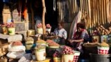 FILE - Women set up their shops at the Konyo Konyo market in Juba, South Sudan, May 12, 2012.