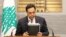 Lebanon's Prime Minister Hassan Diab speaks during a televised address to the the nation at the governmental palace in Beirut