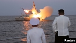 (FILE) North Korean leader Kim Jong Un oversees a strategic cruise missile test aboard a navy warship.