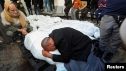 Mourners react next to the bodies of Palestinians killed in an Israeli strike in Rafah in the southern Gaza Strip, Jan. 18, 2024. 