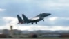 FILE - In this image taken from video, South Korean Air Force's F15K fighter jet takes off Oct. 4, 2022, in an undisclosed location in South Korea. 