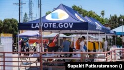 American-Thai voters line up to vote at a Mobile Vote Center
in Wat Thai of Los Angeles during early Midterm Election2022 in Los Angeles, CA. The Mobile Vote Center Program of Los Angeles County implemented and takes a community-based approach and collab