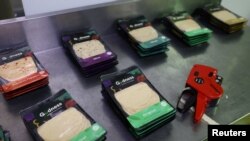 Plant-based polony used as an alternative or meat substitute is placed on the table before being labelled at meat processor Feinschmecker, in Germiston, in the East Rand region of Johannesburg, South Africa, Oct. 11, 2022.