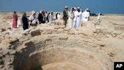Sheikh Majid bin Saud Al Mualla of the Umm Al Quwain Department of Tourism and Archaeology and Noura Al Kaabi, UAE Minister of Culture and Youth, visit the ancient Christian monastery on Siniyah Island in Umm al-Quwain, United Arab Emirates, Nov. 3, 2022.