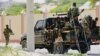 FILE - Somali soldiers are seen riding on a pickup truck in Mogadishu, Somalia, April 27, 2022. 