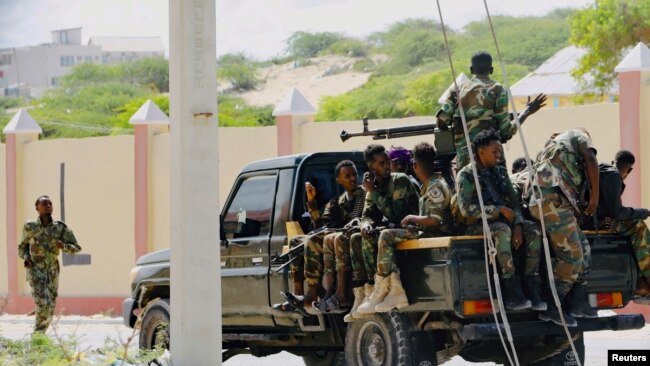 FILE - Somali soldiers are seen riding on a pick-up truck in Mogadishu, Somalia, April 27, 2022.