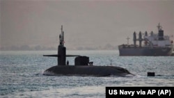 U.S. Navy photo of a guided-missile submarine capable of carrying up to 154 Tomahawk missiles. The Navy said a nuclear-powered submarine traversed the Suez Canal, April 7, 2023.