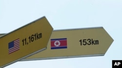 Signs to North Korea's capital, Pyongyang, and the United States are seen at the Imjingak Pavilion in Paju, South Korea, near the border with North Korea, July 20, 2023. 