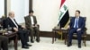 A handout picture released by Iraq's Prime Minister's Media Office on Feb. 5, 2024, shows Iraq's Prime Minister Mohamed Shia al-Sudani, right, meeting with Ali Akbar Ahmadian, left, secretary of Iran's Supreme National Security Council, in Baghdad. 