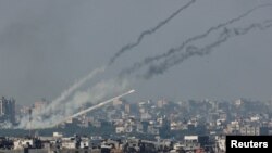 Rockets are launched from the Gaza Strip into Israel, after a temporary truce between Israel and the Palestinian Islamist group Hamas expired, as seen from Israel's border with Gaza in southern Israel.