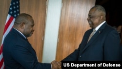 Secretary of Defense Lloyd J. Austin III greets Papua New Guinea Prime Minister James Marape in Port Moresby, Papua New Guinea, July 27, 2023. 