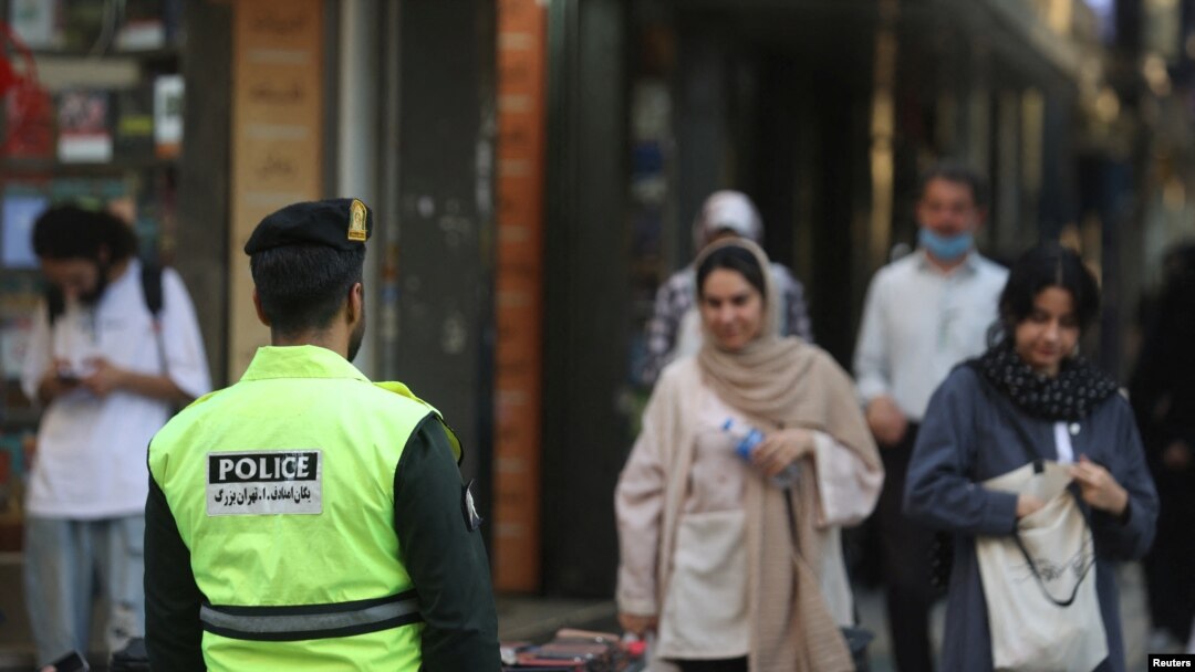 An Iranian police force stands on a street during the revival of morality police in Tehran, Iran, July 16, 2023. (Majid Asgaripour/WANA via Reuters)