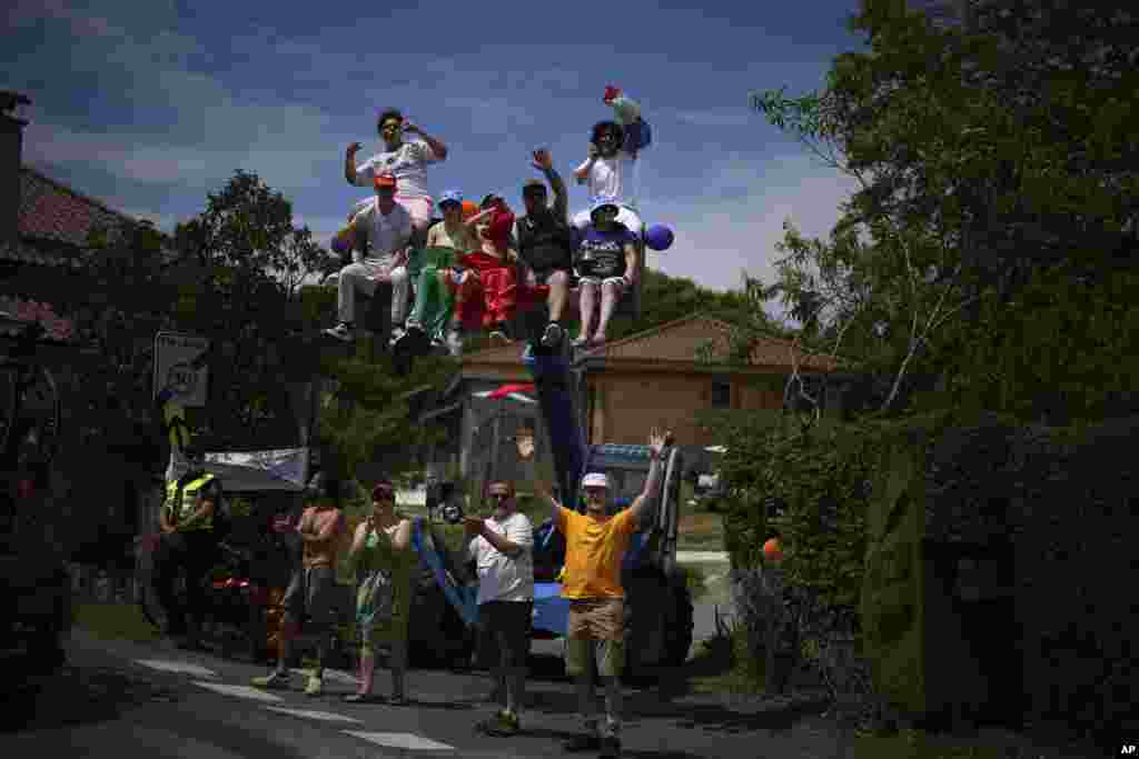 Spectators wait for the peloton to pass during the twelfth stage of the Tour de France cycling race over 203.6 kilometers (126.5 miles) with start in Aurillac and finish in Villeneuve-sur-Lot, France.