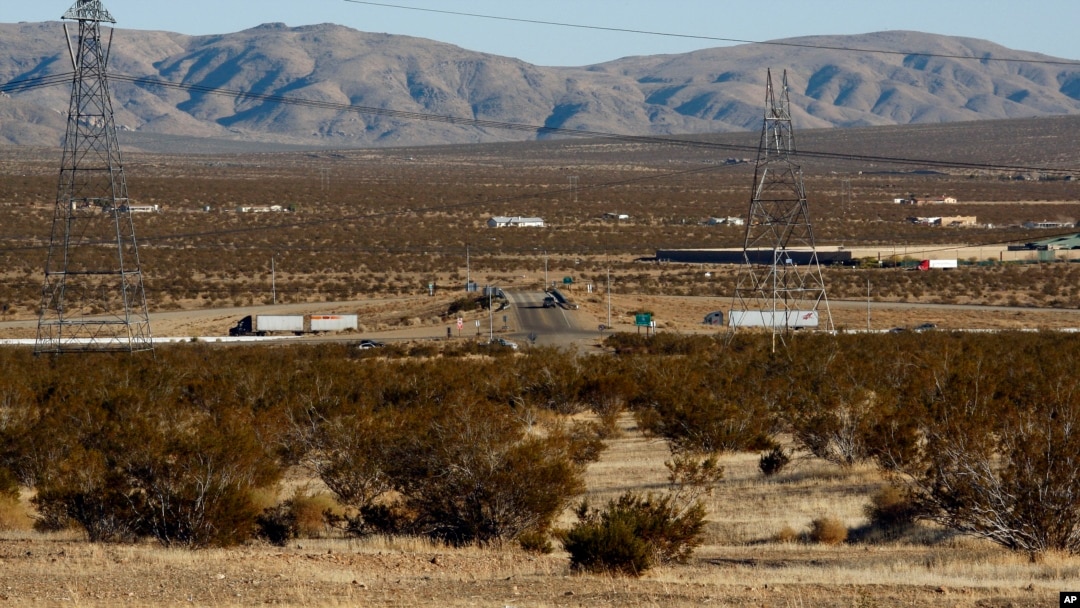 FILE - This Jan. 25, 2012, photo shows the site of a proposed station for a high-speed rail line, with Interstate 15 in the background, on the far outskirts of Victorville, Calif., the Mojave Desert city on the route from Los Angeles to Las Vegas. 