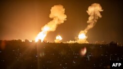 Explosions are seen in Khan Yunis in the southern Gaza Strip during Israeli airstrikes on the Palestinian area.