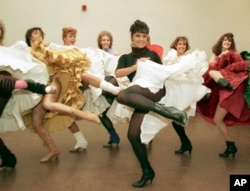 FILE - Broadway star Chita Rivera, foreground, and the Radio City Music Hall Rockettes rehearse Cole Porter's "Can Can" in New York on Jan. 21, 1988. (AP Photo/Marty Lederhandler, File)