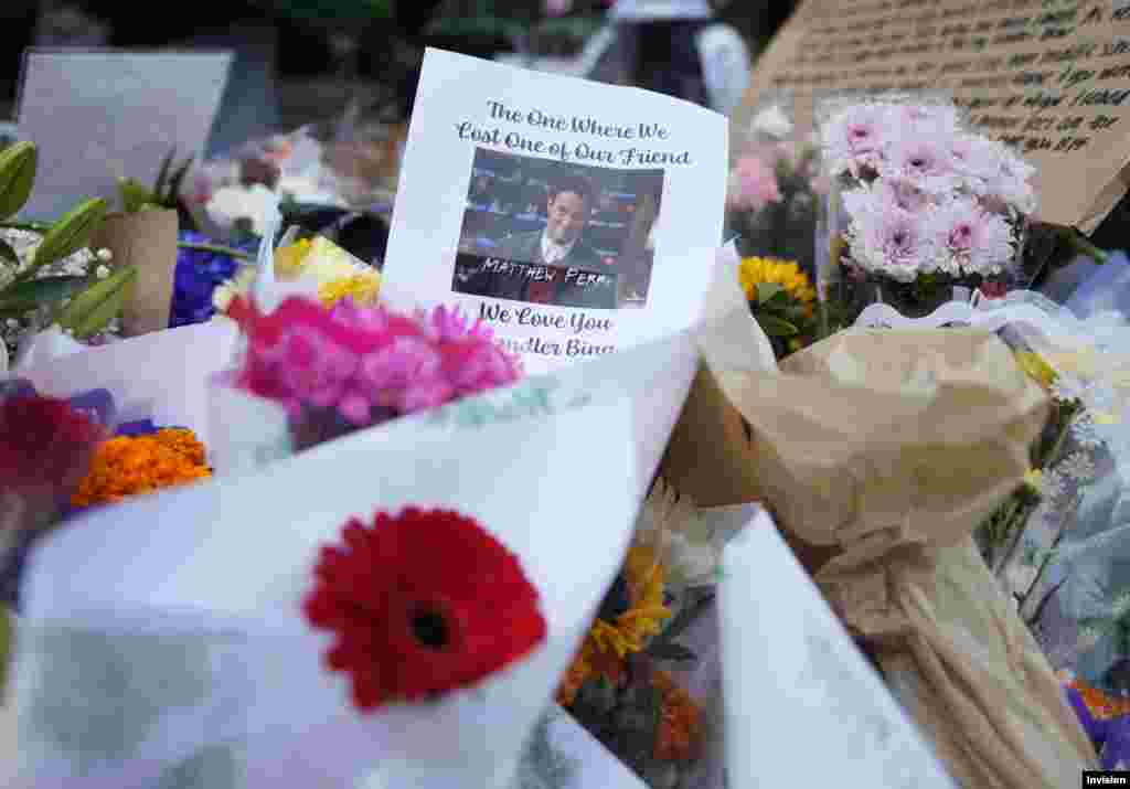 A makeshift memorial for actor Matthew Perry is seen outside the building shown in exterior shots of the television show "Friends," Oct. 30, 2023, in New York. 