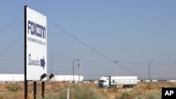 FILE - A truck leaves the Foxconn factory, Aug. 7, 2012, in Juarez, Mexico, just across the Santa Teresa Border crossing from the U.S.