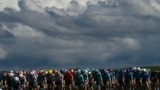 The pack of riders (peloton) cycles during the 6th stage of the 111th edition of the Tour de France cycling race, 163,5 km between Macon and Dijon, July 4, 2024. 