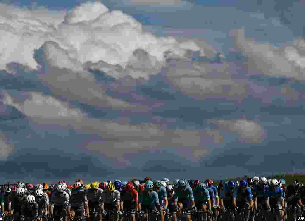 The pack of riders cycles during the 6th stage of the 111th edition of the Tour de France cycling race, 163,5 km between Macon and Dijon, France.